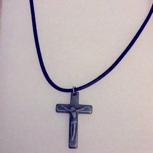 This a Silver Cross necklace.